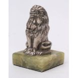 An early 20th century Bean Cars mascot in the form of a seated lion: mounted on later onyx plinth