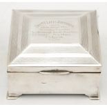 A WWI period silver presentation cigarette box: assays rubbed,