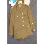 A collection of military uniform: including Tropical Dress, No 1 Dress, trench coat etc,