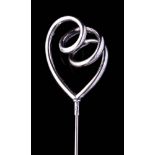 An Edwardian silver looped hat pin, maker 'JW' , Birmingham 1910,: 24cm. long.