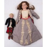 An Armand Marseille bisque shoulder headed doll: applied brown wig, blue glass sleeping eyes ,