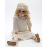 A late 19th /early 20th century German bisque head doll:, with applied blonde wig,
