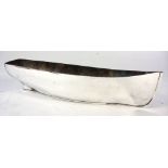 An early 20th Century silver plated serving dish in the form of a fishing boat hull by Elkington &