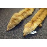 Two mid-20th century mink scarves:, the taxidermy heads inset glass eyes (2).