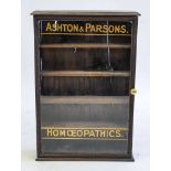 An early 20th century Retailers wall cabinet for 'Ashton & Parson Homoepathics':,