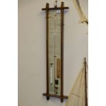 A late 20th Century oak cased Admiral Fitzroy barometer:, 105cm tall.