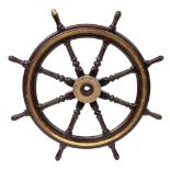 A 19th century teak and brass ship's helm:, with fluted, block and carved spars,