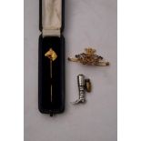 A 9ct gold Horse head stick pin by Garrard & Co, Ltd,