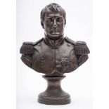 A bronzed resin bust of Napoleon: in military uniform on a socle base, 35cm. high.
