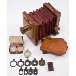 A mahogany and brass 'The International' three quarter plate camera by J Lancaster & Son,