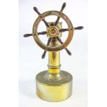 A late 19th/early 20th century Continental brass ship's helm cigar cutter:, unsigned, 15.5cm high.