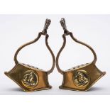 A pair of late Victorian/early Edwardian brass stirrups:,