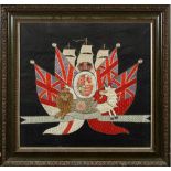 An early 20th century woolwork armorial: the Royal Crest surrounded by Naval and Merchant ensigns