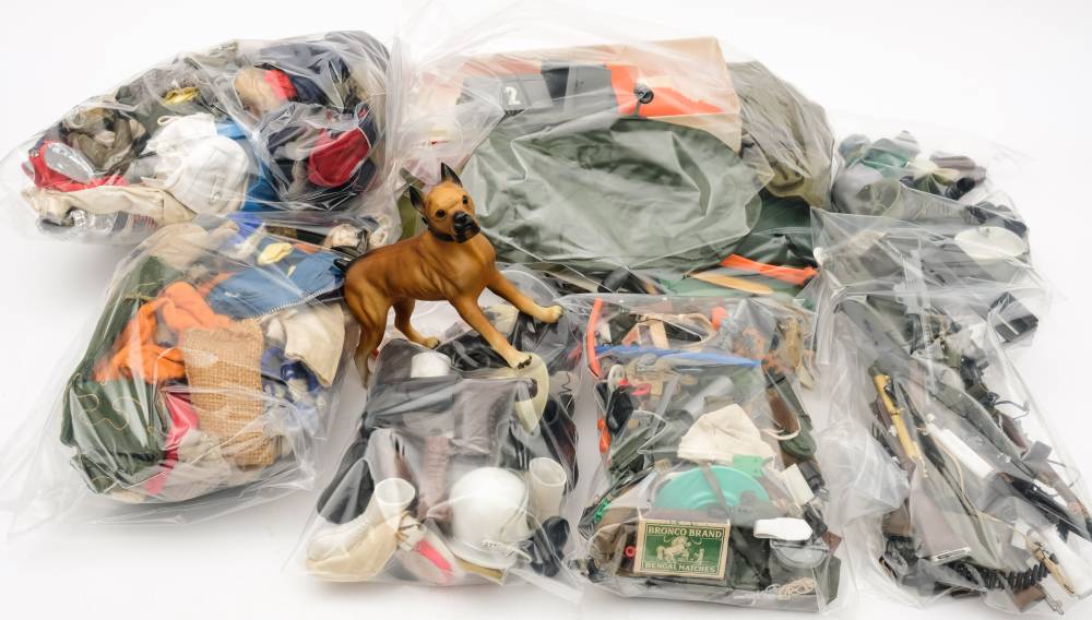 A collection of Action Man clothing, weapons and accessories: including two Exhibition boats,