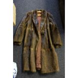 Two mid 20th century fur coats: together with a mink muff,