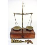 A set of 19th century lacquered brass and mahogany balance scales: unsigned,
