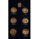 An Official John Pinches Churchill Commemorative album of 24 medals: gold plated on silver each 26g.