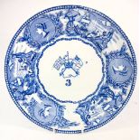 A Victorian blue and white Mess plate: 'young -head' pattern with central crossed flags and crown