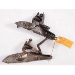 Two steel swan neck flintlock actions,one signed and dated 1742: the other unsigned (2).