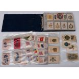 An album of assorted silk cigarette cards,