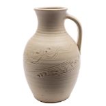 *Ray Finch [1914 - 2012] a stoneware jug: of oviform with raised ribbed neck and a ribbed strap