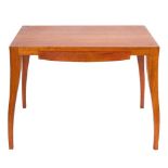 A late 20th Century cherry wood desk by Tracy Byles: the plain rectangular top with single bowfront