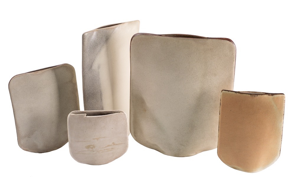 *Val Barry [1937-2018] five stoneware 'sail' vases: of narrow slab built form with distorted