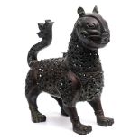 A Persian cast brass censer : in the form of a cat, with hinged neck and head,