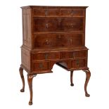 An 18th Century walnut and seaweed marquetry chest on stand: with foliate bandings bordered with