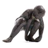 After Karel Vogel, a bronze figure of a crouching man: attending to his left foot, unsigned , 17cm.