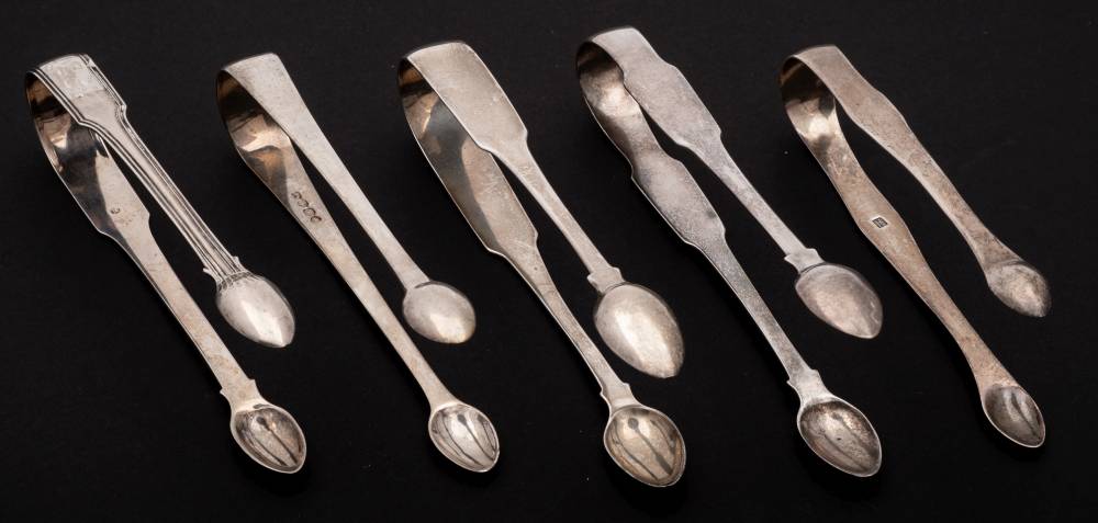 Two Irish and three English silver pairs of sugar tongs,