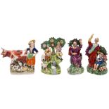 A group of four Staffordshire pottery figures: two of Walton type with bocage backgrounds,