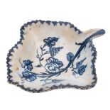 A Lowestoft blue and white leaf pickle dish: painted with a vine branch and grapes, serrated rim,