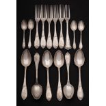 A collection of Continental white metal flatwares: includes dessert spoons, dessert forks,