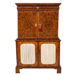 An early 18th Century reconstructed oyster and burr veneered walnut inlaid cabinet: in two sections,