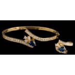 A modern 18ct gold sapphire and diamond cluster cross-over hinged bangle and matching ring: each