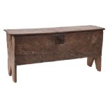 A 17th Century oak later carved plank coffer:, with incised decoration,