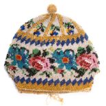 A 17th century floral banded beadwork purse: the floral sprays worked in coloured beads of blues,