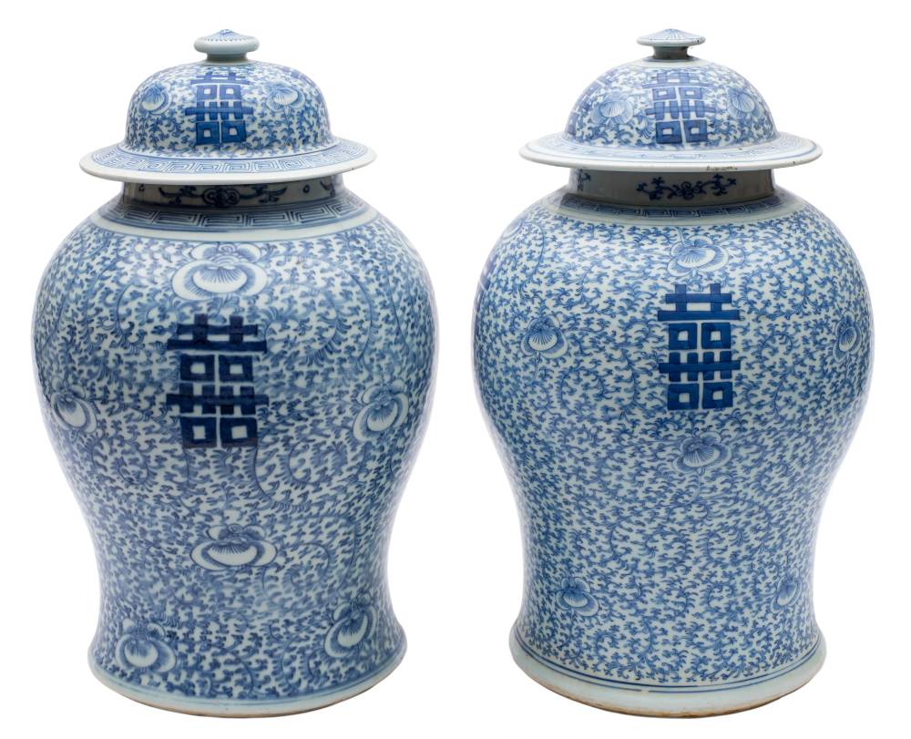 A pair of Chinese blue and white 'Shou' baluster jars and covers: painted with shou characters on a