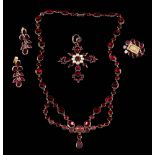 A Georgian flat garnet necklace: with oval and circular garnets in closed back settings and