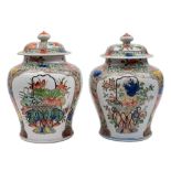 A pair of Samson famille verte baluster vases and covers: decorated in the Kangxi manner with lotus