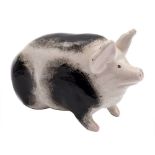 A Wemyss pottery pig: modelled in seated posture, with mottled grey markings,