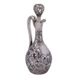 An Art Nouveau period Continental clear glass and silver mounted decanter and stopper: with slender