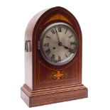 A lancet-shaped mantel clock: the eight-day duration movement striking the hours and half-hours on