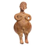 An Indo-Persian terracotta fertility figure: with moulded face, hair detail,