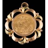 A sovereign dated 1912 mounted as a pendant/brooch: within a frame stamped '750',