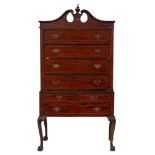 A 19th Century mahogany and inlaid highboy: in the American manner, bordered with boxwood lines,