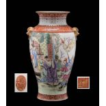 A large Chinese famille rose baluster vase: with gilt lion dog ring handles,