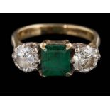 An emerald and diamond three-stone ring: with central rectangular emerald 6.5mm x 6.