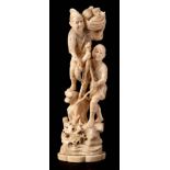 A Japanese carved ivory okimono of a fisherman : landing a fish from a rocky outcrop,